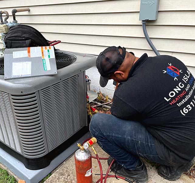 Professional AC repair service being performed in a Centereach, NY home.